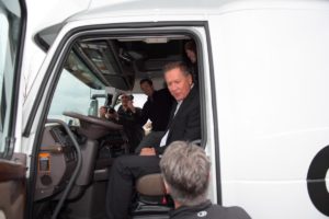 CEO and truck driver sitting in Otto delivery truck