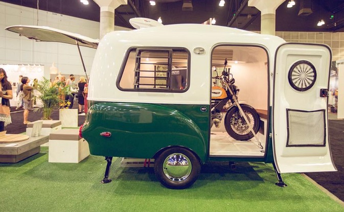 HC1 at a trade show with a motorcycle in it