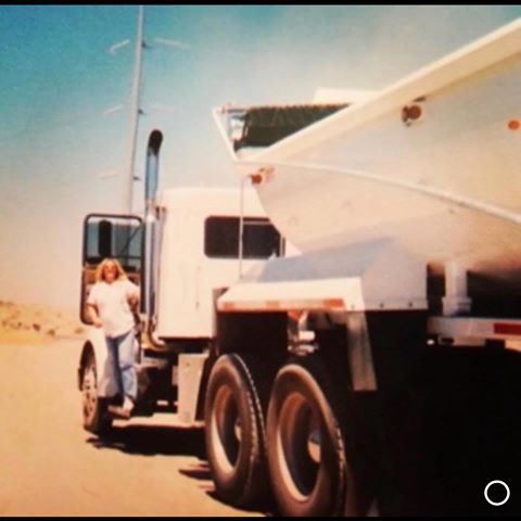 Woman outside of white truck
