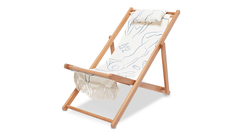 wood beach chair with white and blue canvas covering from Chairish