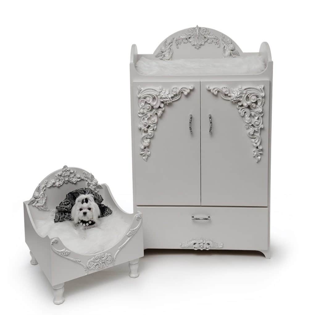 white dog on luxury white dog cradle and armoire