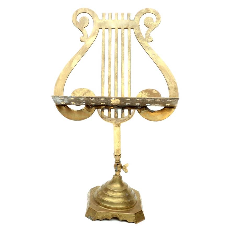 gold colored brass music stand