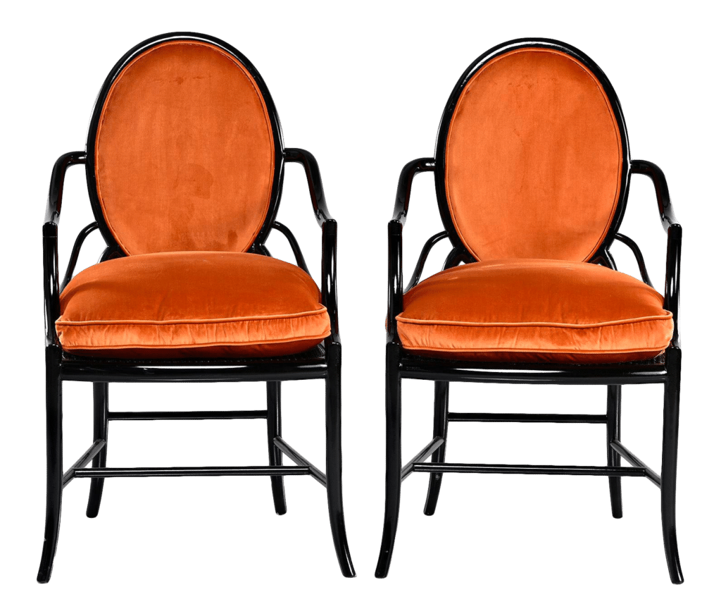 pair of orange velvet armchairs