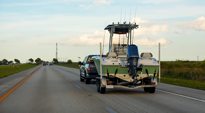 Trailer hauling a used boat for a boat restoration project
