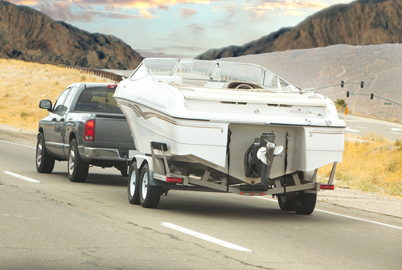 truck hauling boat on trailer