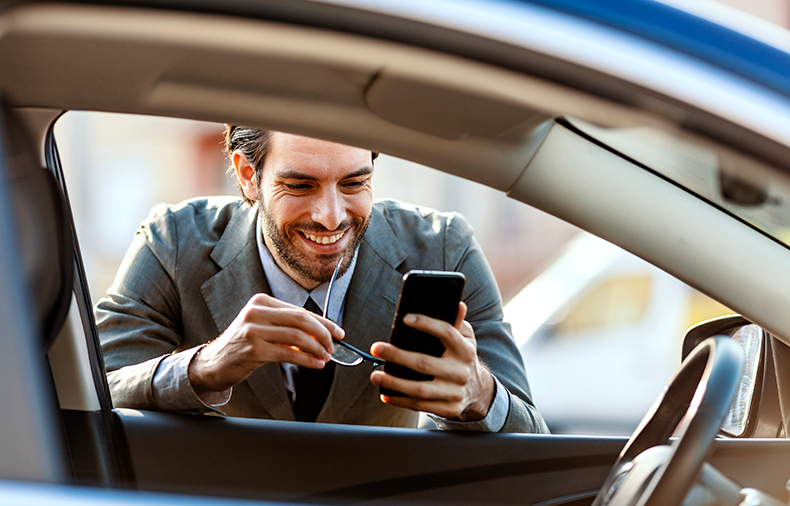 smiling man shipping a car cross country