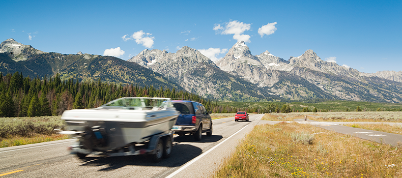 truck pulling boat with trailer - example of DIY boat shipping