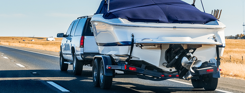 truck pulling boat protected with boat shipping insurance