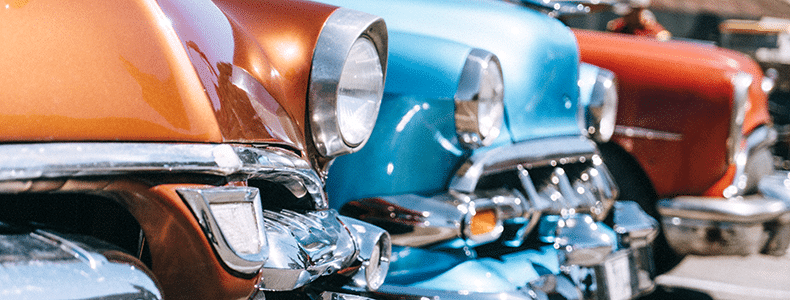 Colorful row of classic cars and antiques
