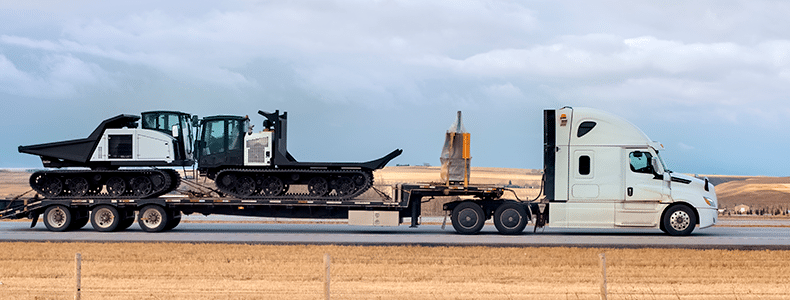 heavy equipment transport on a semi
