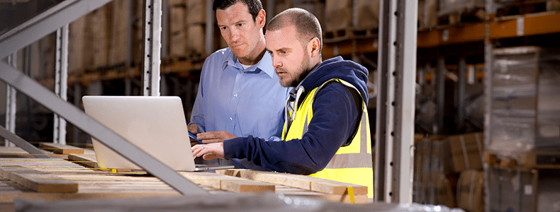 Business shippers double checking the bill of lading before LTL freight shipment