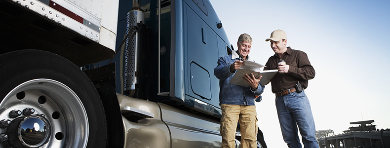 a business shipper signing off on the bill of lading with transporter