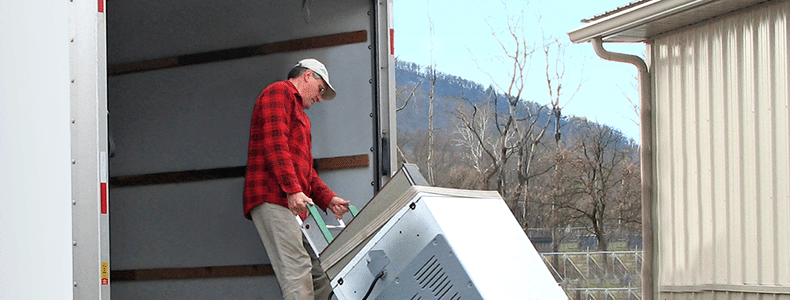 man moving household goods appliance