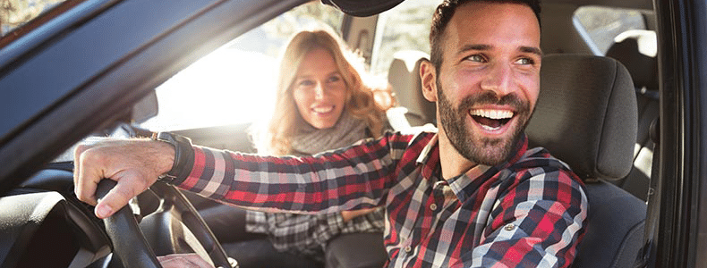 Happy couple in car