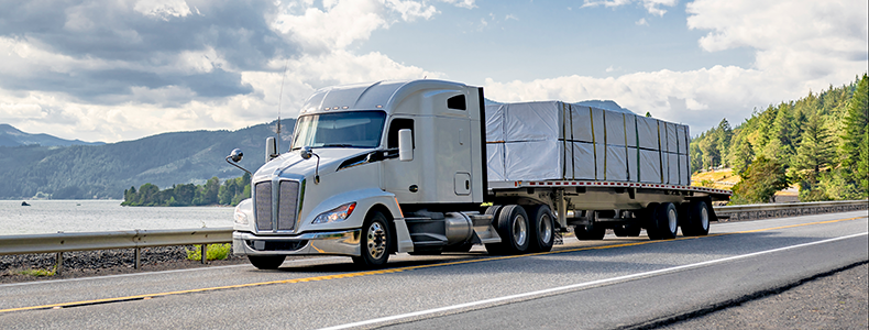 flatbed trailer used in shipping by trucking