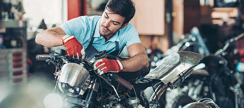 man prepping for motorcycle shipping