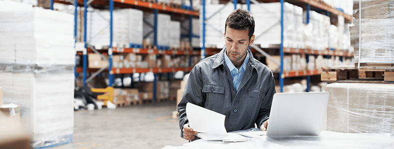 man in factory comparing Freight Broker vs. Freight Shipping Marketplace
