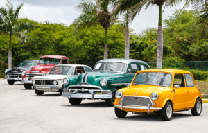 A line of vintage cars at an auto auction waiting for transport