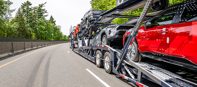 How Seasonal Demand Affects Car Shipping Rates and Availability, and How to Save 2 open car trailer on road