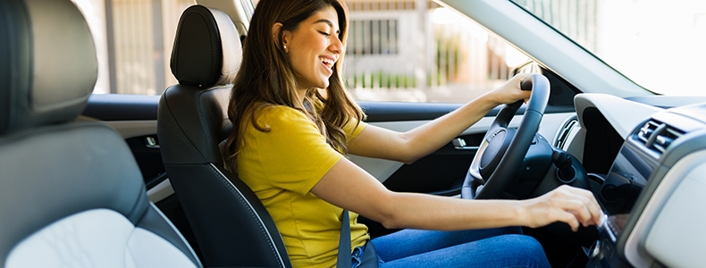 happy woman in new car